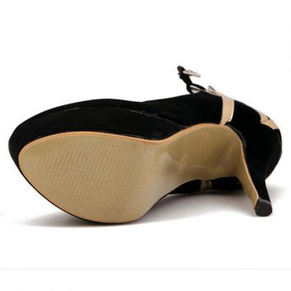 black high heels with gold ankle strap